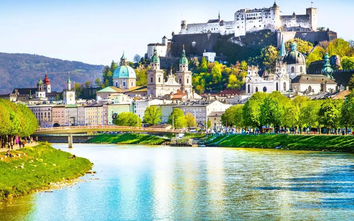 Salzburg old town across the river, domes and the fortress on the hill above