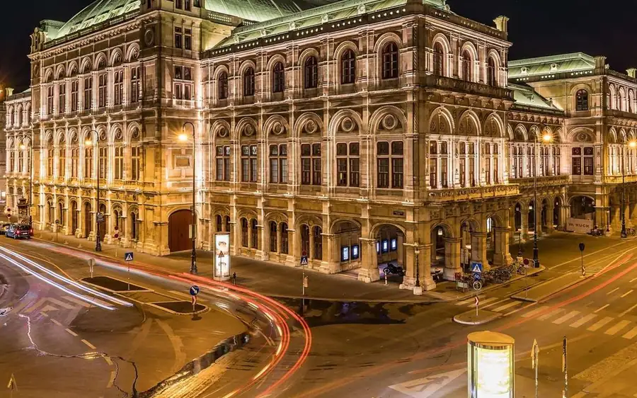 The Vienna State Opera at night with light trails from passing traffic
