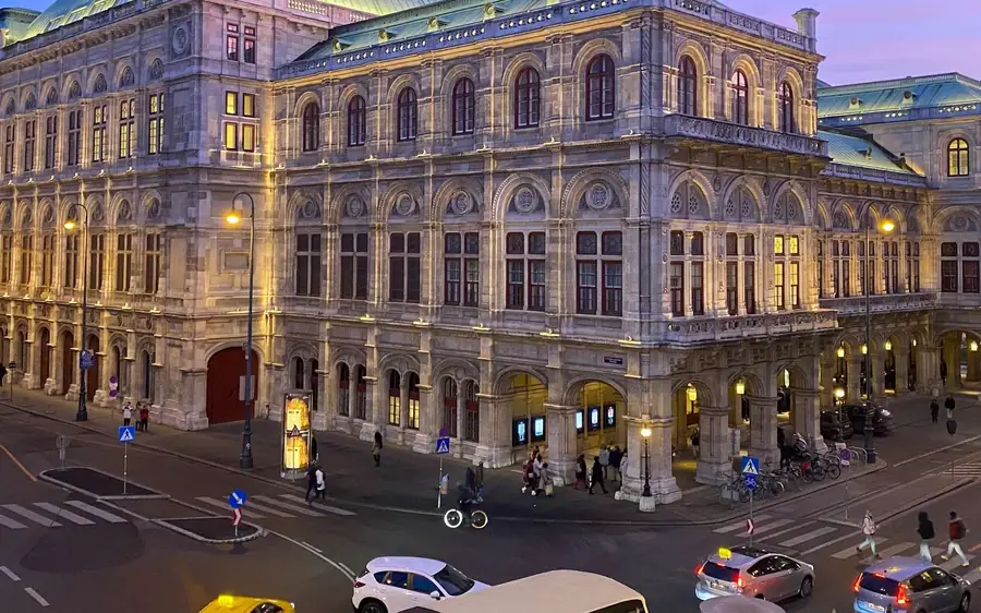 The Vienna State Opera lit up at dusk