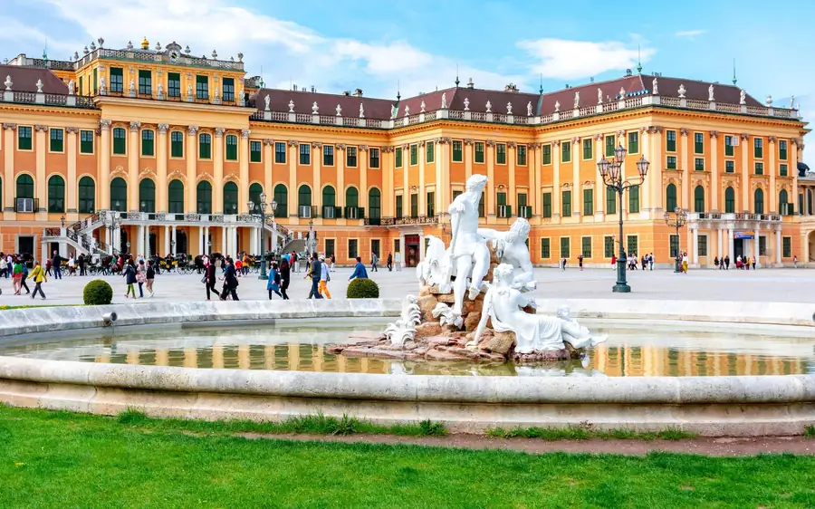 Schönbrunn Palace with a sculpted fountain in its courtyard